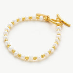 White Freshwater Pearl Bracelet, crafted with lustrous white pearls, this bracelet exudes a radiant glow and delicate charm, elevating your look with a touch of natural beauty and grace.