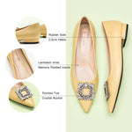 Step into sophistication with these yellow flats featuring a crystal buckle, perfect for a polished and refined look.