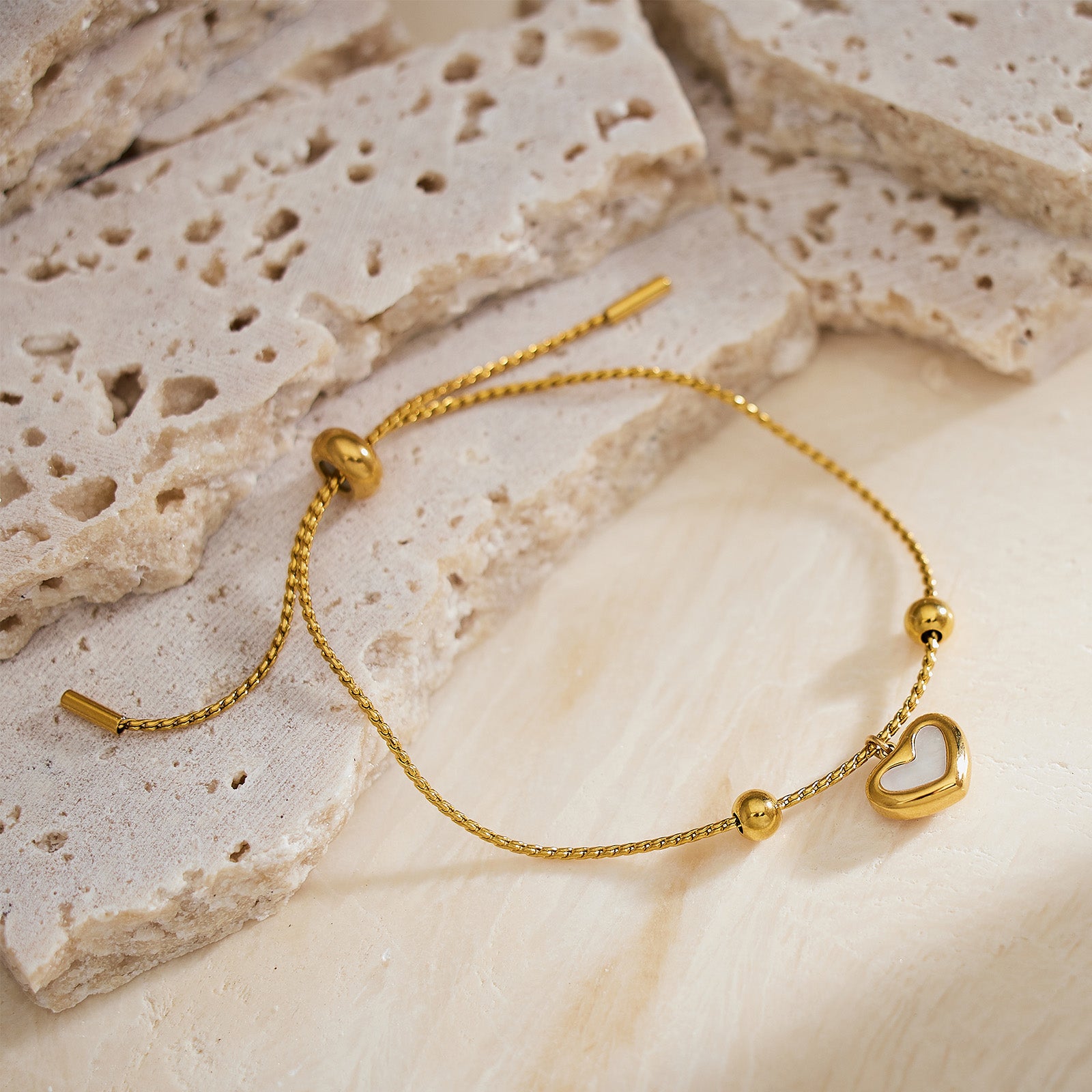 Shell Drop Bracelet in Gold, cascading with golden shells, this bracelet features a cascade of intricately designed shell charms in a radiant gold hue, creating a mesmerizing and glamorous accessory