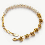 Molten Baroque Pearl Twisted Chain Bracelet, a fusion of modern design and classic pearls in gold, this bracelet brings a contemporary twist to traditional elegance, making it a versatile and chic accessory.