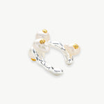 Silver Baroque Pearl Ear Cuff, a sleek and modern accessory that adds a touch of contemporary elegance to your ear