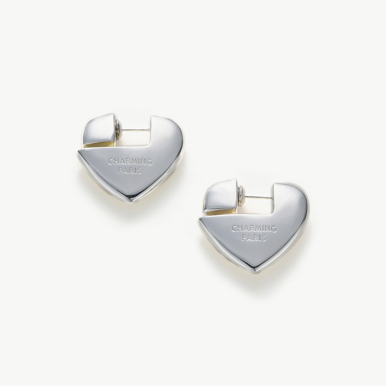 Heart Hoop Earrings in Silver, radiating with a silver sheen, these hoops bring a touch of modern elegance and romance to your style