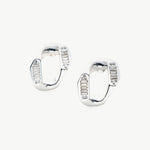 Contemporary Silver Charm: Crystal-adorned Wavy Stud Earrings in silver, a contemporary and stylish choice that complements your look with understated elegance