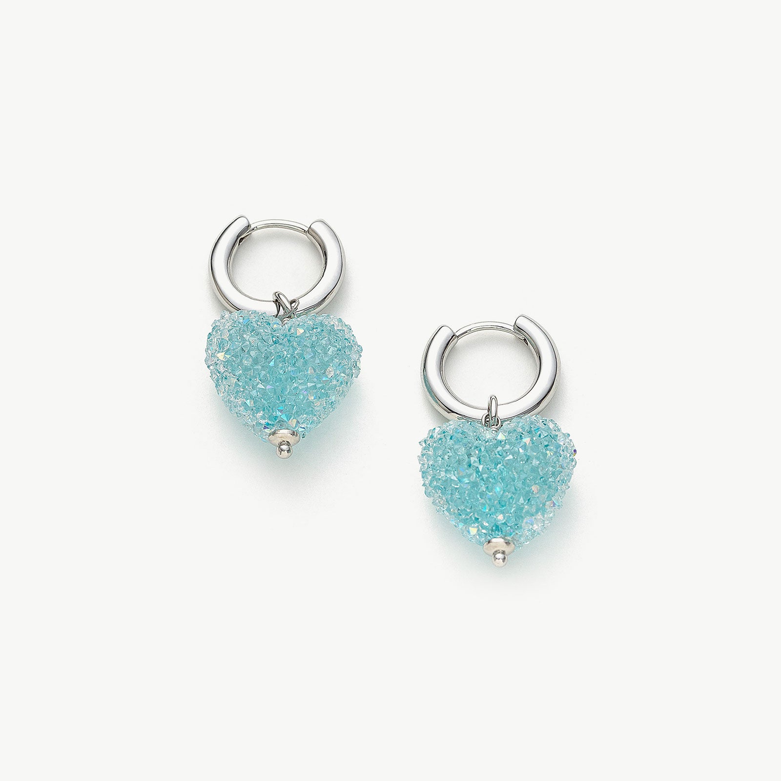 Shining Heart Hoop Earrings in Blue, a sapphire-hued accessory with heart-shaped hoops that embody elegance and sophistication for a timeless look.