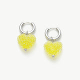 Shining Heart Hoop Earrings in Yellow, radiating with the warmth of sunlit charm, these hoops feature heart shapes in a delightful shade of yellow for a vibrant and luminous look