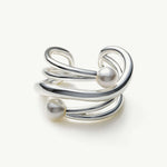 Silver Claw Pearl Ear Cuff, a sleek and modern accessory that adds a touch of contemporary elegance to your ear