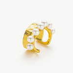 Gold Pearl Ear Cuff, a luxurious and opulent accessory that adds a touch of regal charm to your ear