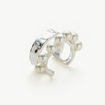 Silver Pearl Ear Cuff, a sleek and modern accessory that adds a touch of contemporary elegance to your ear