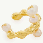 Gold Ear Cuff adorned with a baroque pearl, a statement accessory that exudes sophistication and glamour.