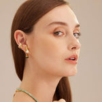 Silver Ear Cuff adorned with a baroque pearl, a statement accessory that exudes modern sophistication and charm