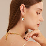 Heart Tunnel Hoop Earrings, a symbolic accessory that creates a tunnel of affection with delightful heart motifs, perfect for expressing love