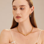 Hoop Earrings adorned with heart-shaped tunnels, a chic and stylish choice that embraces your ears with a touch of playful elegance