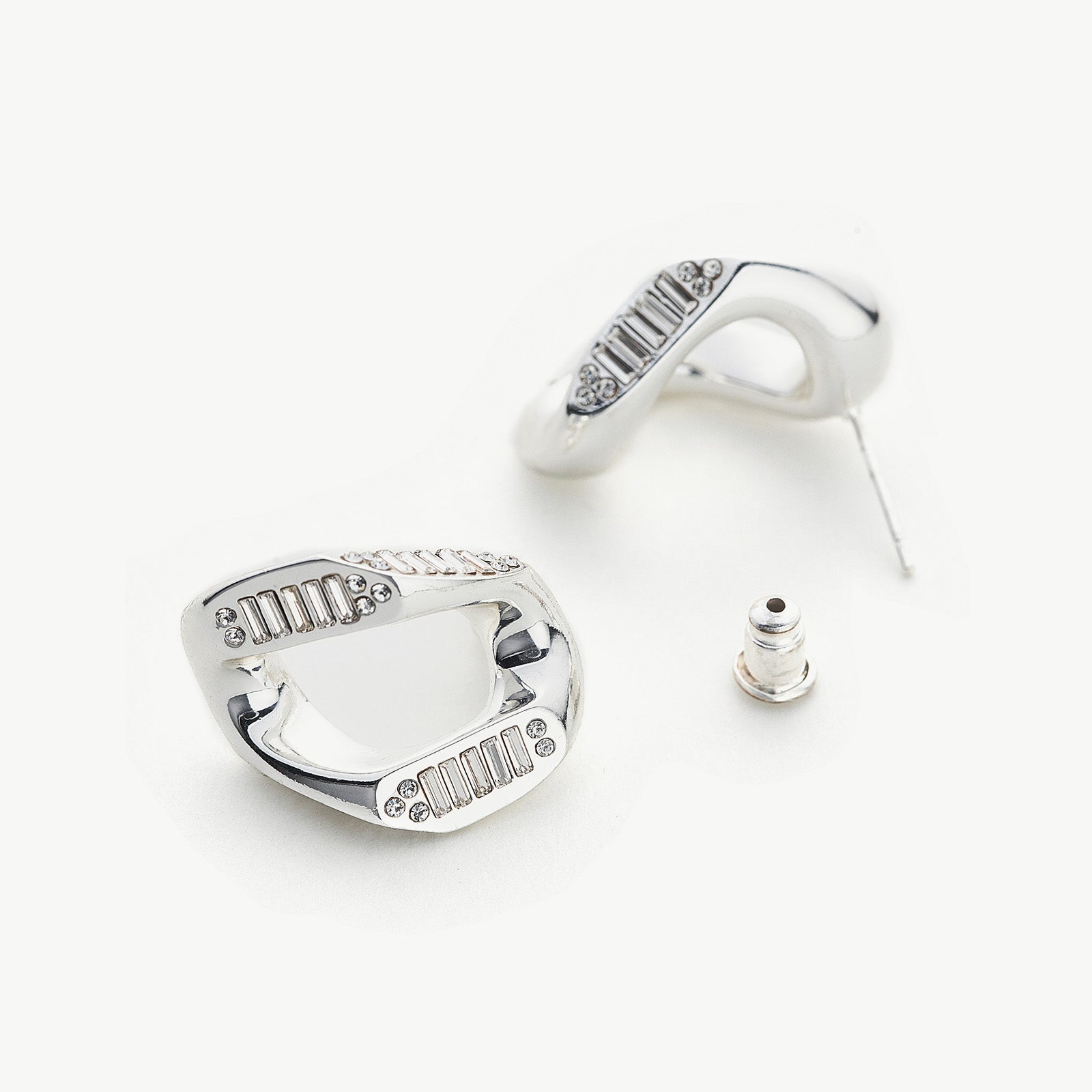 Crystal-adorned Wavy Stud Earrings in silver, a contemporary and stylish choice that complements your look with understated elegance