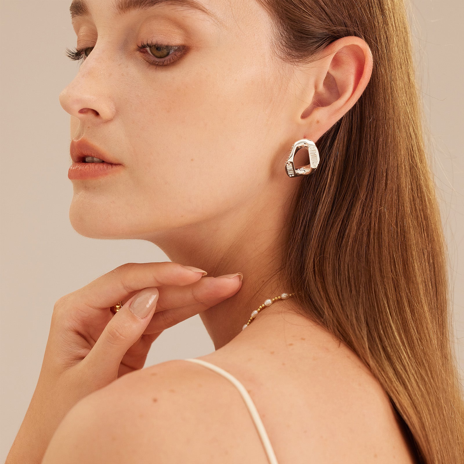 Silver Crystal Wavy Stud Earrings, a chic and moonlit accessory that adds a touch of sophistication and charm to your ensemble