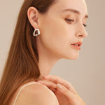 Gold Crystal Wavy Stud Earrings, featuring sparkling crystals in a wavy design for a dazzling and glamorous look