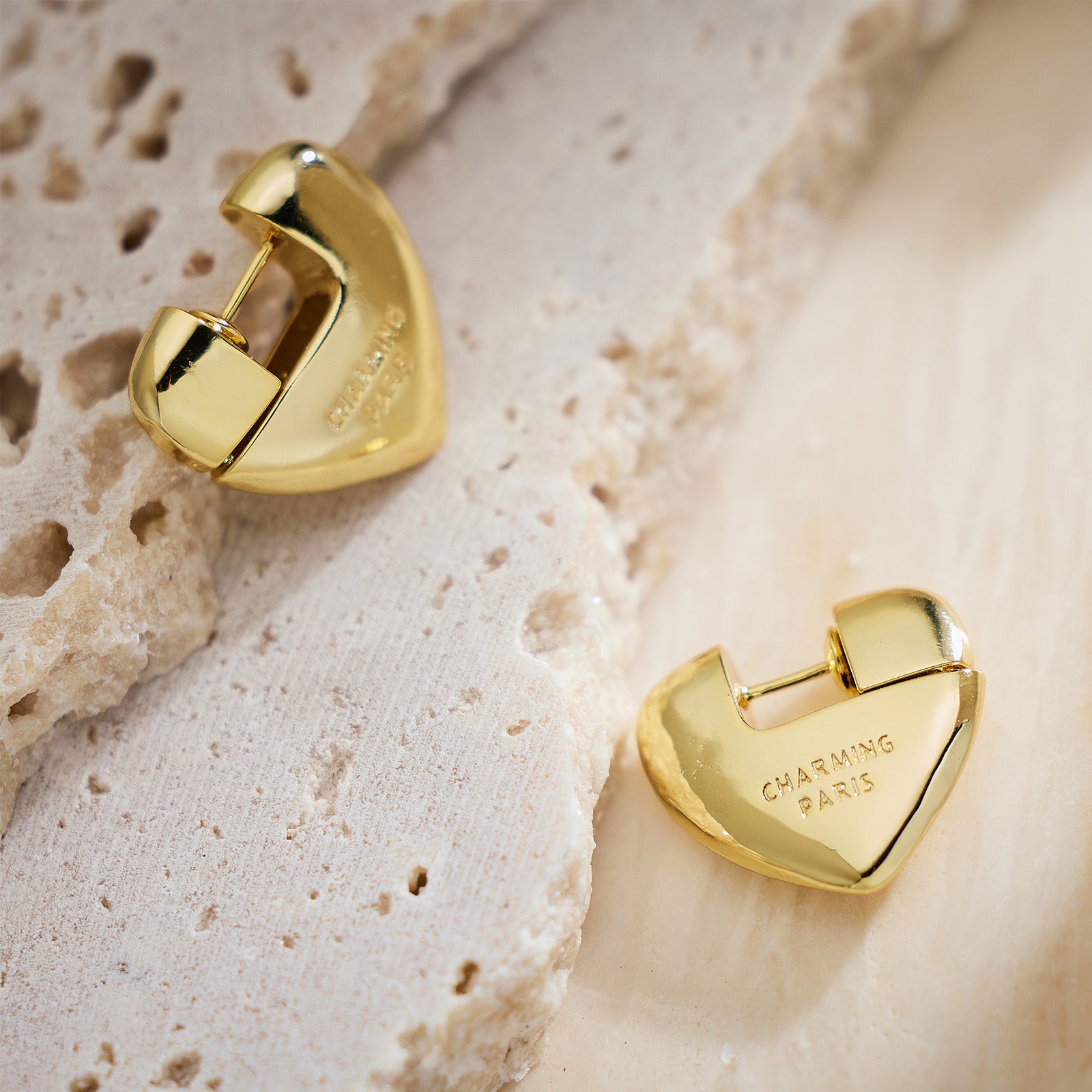 Gold Heart Hoop Earrings, creating luxurious loops of love around your ears, these hoops add a touch of opulence to your look.