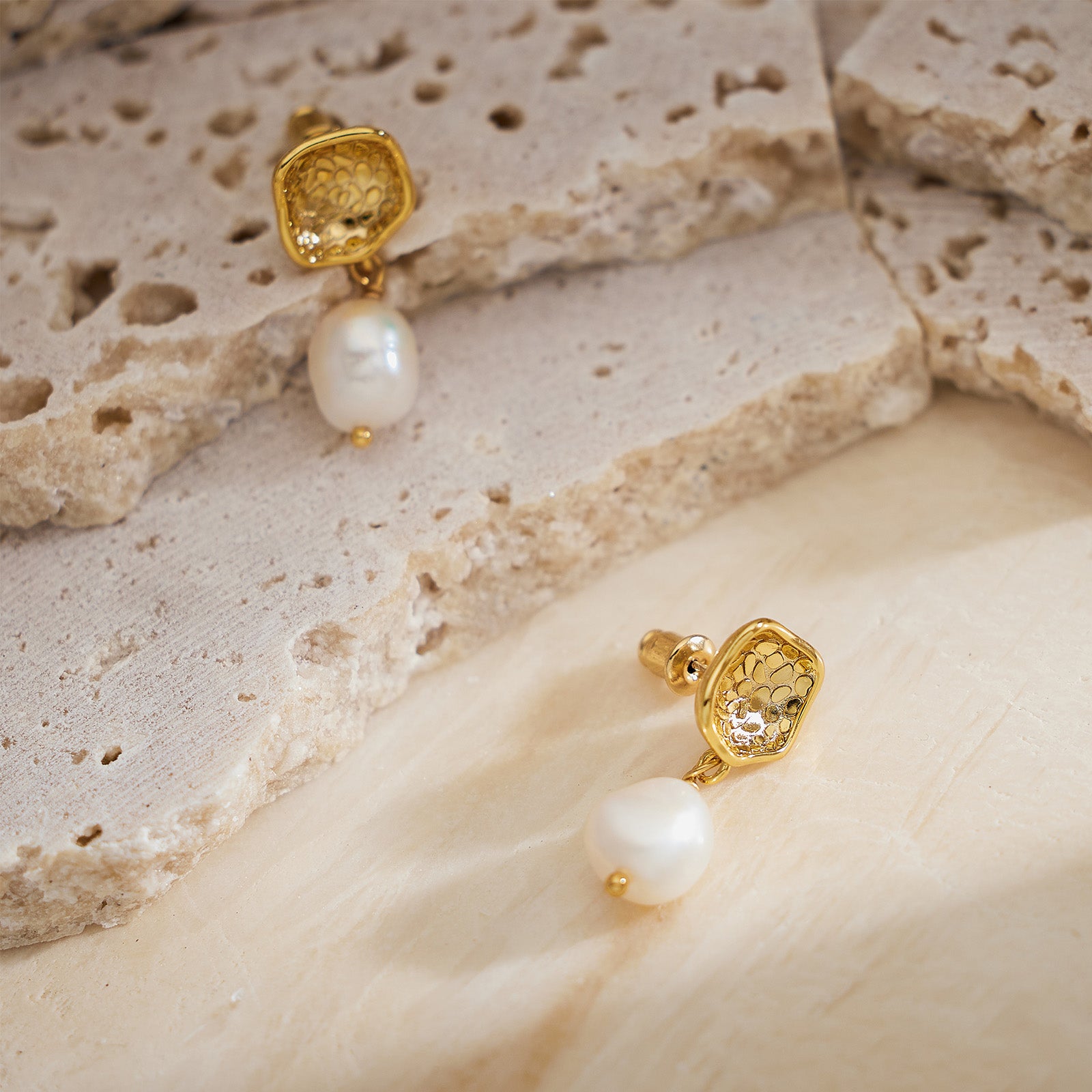 Molten Baroque Pearl Drop Earrings, featuring a fusion of modern design and classic pearls, these earrings bring a contemporary twist to traditional elegance, making them a versatile accessory