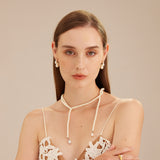 Double Pearls Earrings in Silver, a sleek and sophisticated pair featuring dual pearls for a modern and refined look