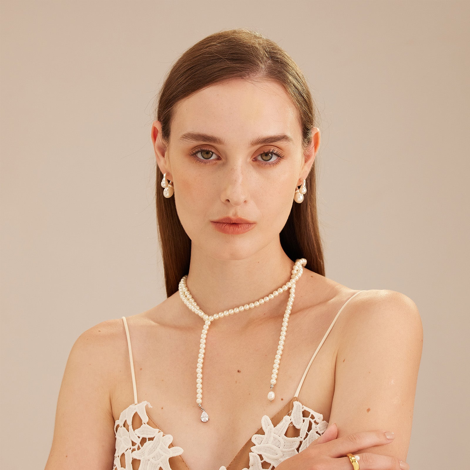 Double Pearls Earrings in Silver, a sleek and sophisticated pair featuring dual pearls for a modern and refined look