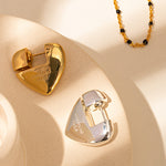 Silver Heart Hoop Earrings, embodying simple elegance with heart-shaped hoops, a versatile and refined choice for any occasion