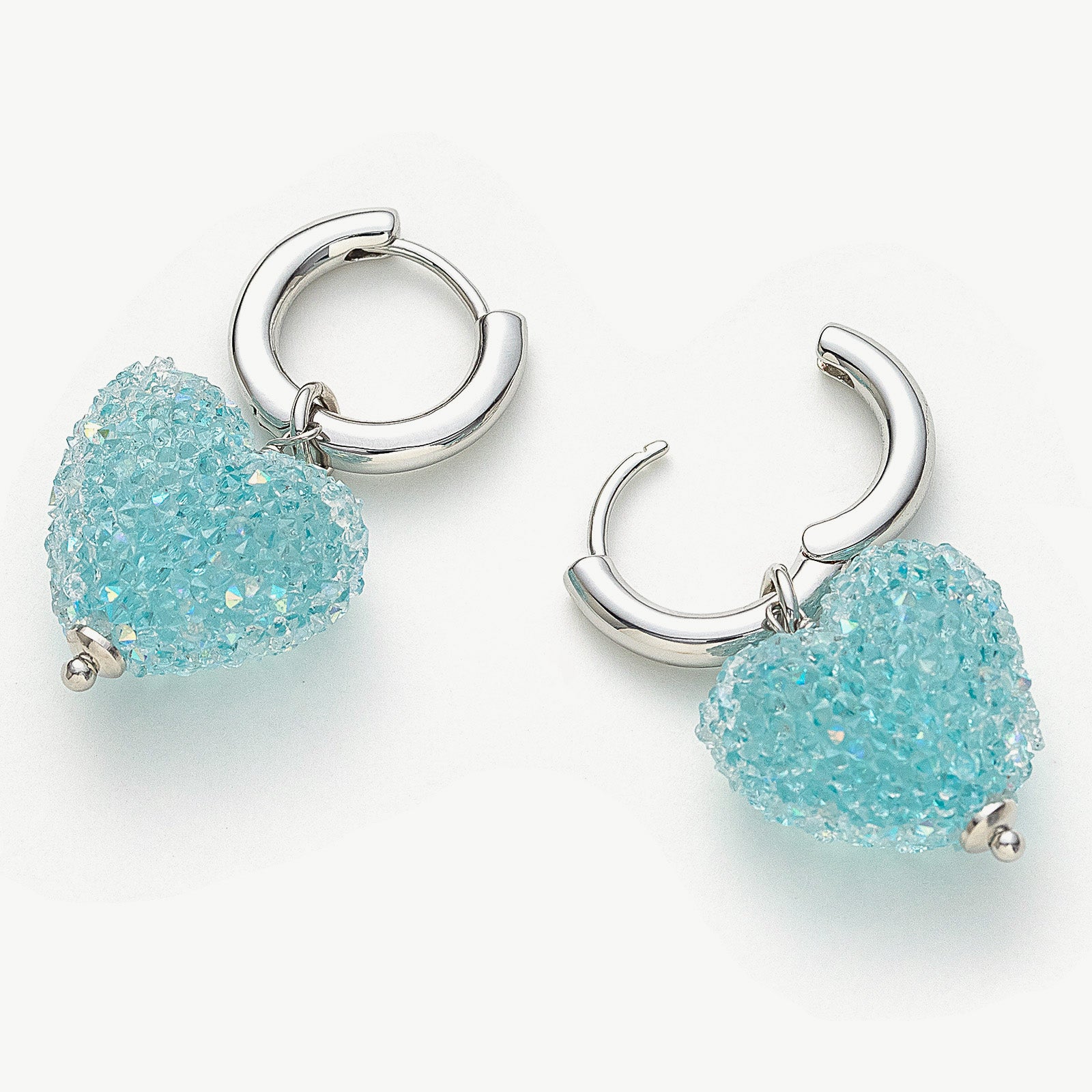 Shining Heart Hoop Earrings in a serene shade of blue, offering graceful loops of serenity that enhance your style with a touch of sparkle and chic vibes.