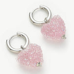 Heart Hoop Earrings in Blush Pink, an elegant and stylish accessory that adds a touch of sophistication with heart-shaped hoops in a soft and blush-toned pink