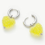 Shining Heart Hoop Earrings in Yellow, pretty and radiant, these hoops bring a touch of glamour to your ears with their heart-shaped design and vibrant yellow color