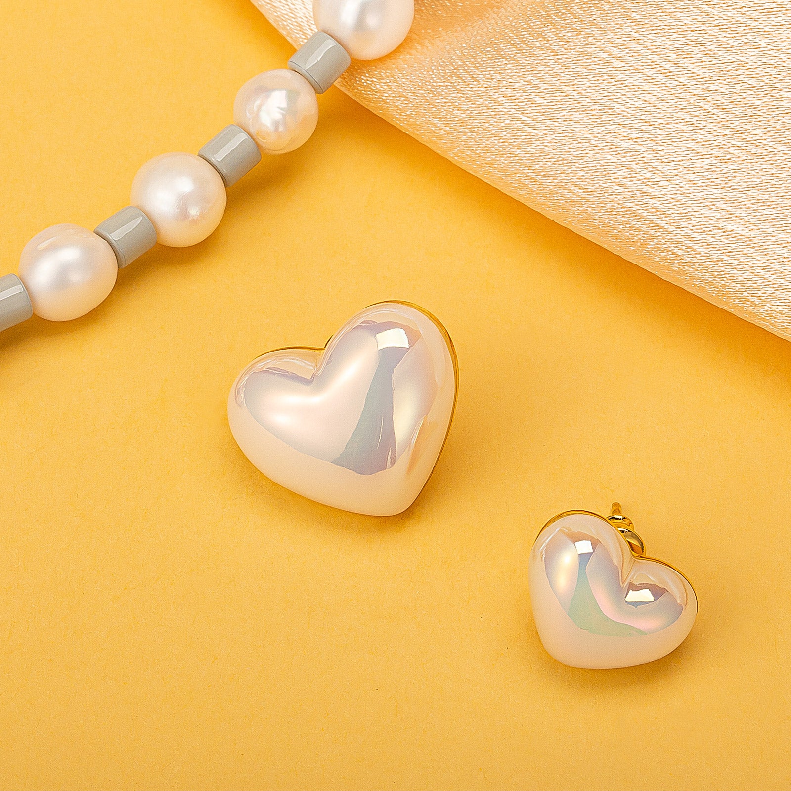 Small Heart Stud Earrings, a delicate and petite pair that captures the essence of love in a minimalist design