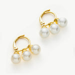 Gold Pearl Huggies, an eternal embrace of pearls and gold, creating a timeless and versatile accessory for a touch of luxury.