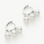 Silver Pearl Huggies, a timeless and classic choice that seamlessly blends the enduring beauty of pearls with the sleekness of a silver embrace