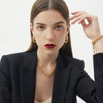 Ring Entwine Chunky Earrings, showcasing a modern twist with gold entwined rings, these earrings bring a touch of contemporary style to your overall look