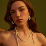 Flower Entwine Earrings featuring a chic floral twist, these earrings blend modernity with timeless charm, offering a fashionable and eye-catching choice for your jewelry collection