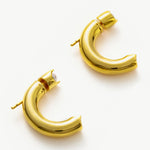 Gold Mini Hoop Earrings, showcasing gleaming gold tones in a mini design, perfect for a subtle and elegant statement.