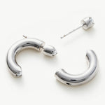 : Mini Hoop Earrings with dainty silver loops, a delicate and chic choice for those seeking understated elegance in their ear jewelry collection