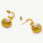 Pearl Shell Hoops with sculpted seashell details, these hoops evoke a harmonious blend of nature's beauty, capturing attention with their intricate design and pearl radiance.