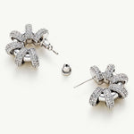 Coiled Single Earrings, adorned with a chic coil charm, these earrings blend charm with modernity, creating a versatile and stylish accessory for any occasion.