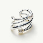 Claw Pearl Ear Cuff in silver, a lustrous and stylish piece that enhances your look with a cool and radiant shine
