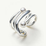 Silver Ear Cuff adorned with a pearl, a statement accessory that exudes modern sophistication and charm