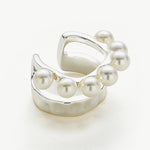 Silver Ear Cuff adorned with a pearl, a statement accessory that exudes modern sophistication and charm