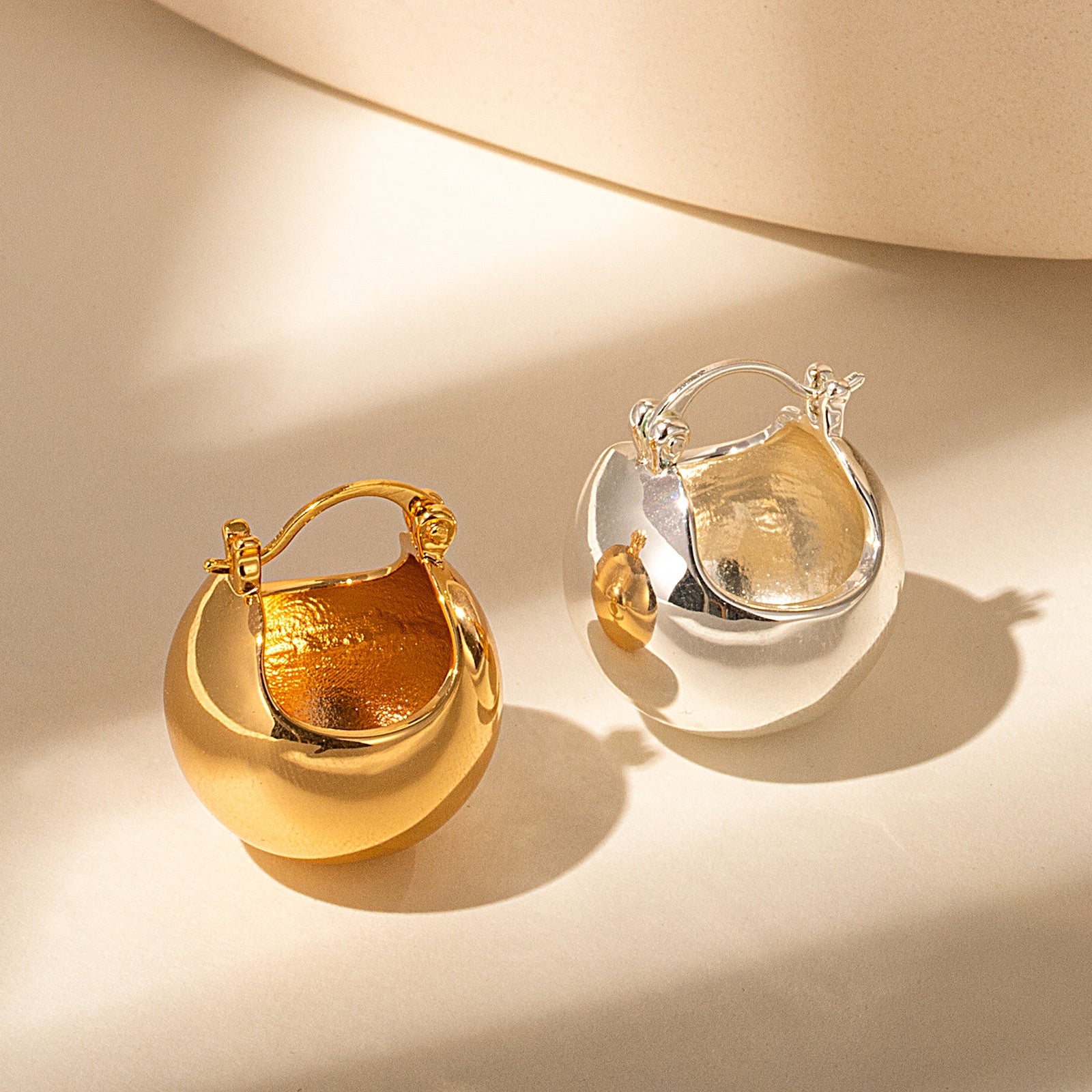 Semiphere Hoop Earrings with sculpted details, these hoops bring a touch of sculptural appeal to your style, making them a chic and trendy choice for your jewelry collection.