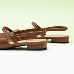 Brown Pointed Toe Slingback Flats, perfect for a confident and fashionable look in any urban setting