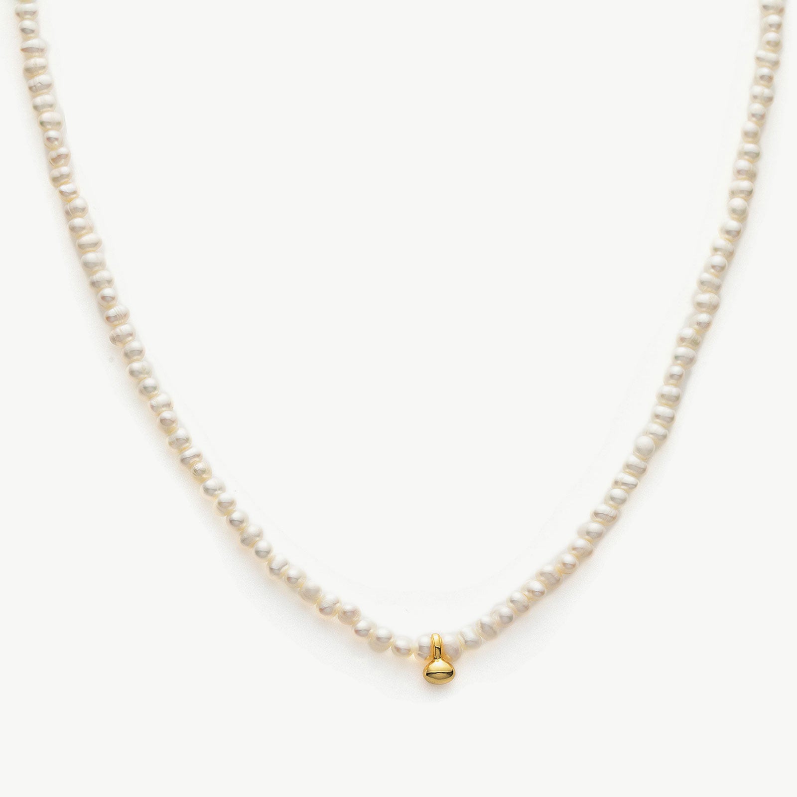 Pearl Gold Pendant Choker, a symbol of timeless elegance, this choker features a lustrous pearl pendant suspended from a delicate gold chain, creating a classic and sophisticated accessory for any occasion