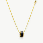 Black Ring Pendant Chain Necklace, a chic and versatile piece with a bold contrast, featuring a black ring pendant suspended from a delicate chain, adding a touch of modern sophistication to your neckline