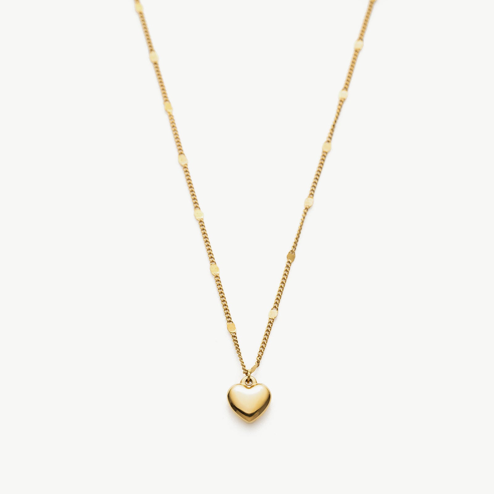 Heart Pendant Necklace in Gold, a timeless piece showcasing a heart-shaped pendant in radiant gold, adding a touch of elegance and sophistication to your neckline