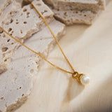 Pearl Drop Pendant Necklace in Gold, radiating eternal gold radiance, this necklace features a captivating pearl drop pendant suspended from a delicate gold chain, expressing enduring style and grace