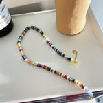 Multi Shell Necklace, exuding tropical vibes, this necklace features a cascade of shells in vibrant hues, adding a pop of color and a touch of exotic flair to your look