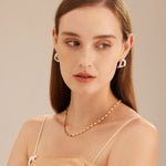 Sea Pearl Beaded Necklace, a radiant pearl accent adorned with seaside-hued beads, capturing the essence of coastal beauty and creating a stylish and timeless accessory.