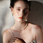 Pearl Gold Pendant Choker, a chic pearl adornment, this choker combines the warmth of gold with the timeless beauty of pearls, creating a versatile and stylish accessory that complements both casual and formal looks