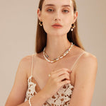 Beaded Stack Necklace, a versatile ensemble of beads stacked together in harmonious colors, allowing you to effortlessly mix and match with various outfits for a trendy and stylish look.