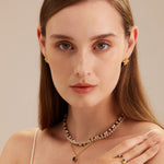 Gold Stone Beaded Necklace, a chic combination of golden beads and stone accents, creating a stylish and versatile accessory that enhances your ensemble with a touch of glamour